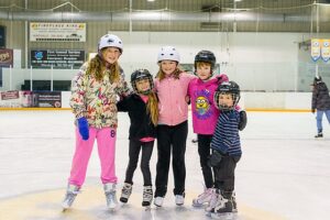 Children skating in ice rink. Source: Town of Huntsville (https://www.flickr.com/photos/townofhuntsvilleon/31231375130/)